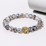 Pulseira de Pedra Natural com Cabeça de Leão, símbolo de força e liderança.